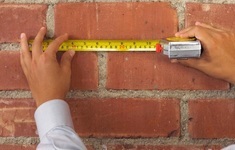 materialy budowlane cegla sciana miarka